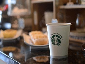 Enjoy a complimentary cup of starbucks coffee from the clubhouse at hawthorne at main